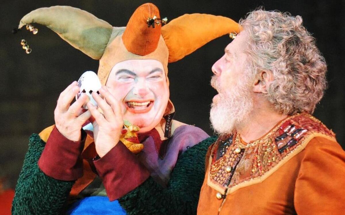 
Phil Fiorini gives an inspired performance as the Fool, the only character who can speak the truth to King Lear (John Rensenhouse) in the Heart of America Shakespeare Festival’s production of “King Lear.” The show runs through July 5 at Southmoreland Park in Kansas City.
