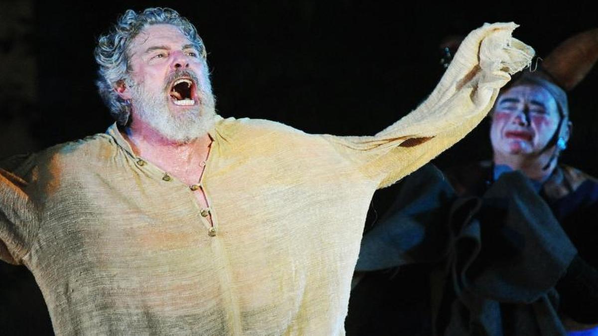 
As King Lear (John Rensenhouse) goes mad, the Fool (Phil Fiorini, right) cries in a rehearsal for the Heart of America Shakespeare Festival. Lear decides to divide his kingdom into thirds — one for each of his daughters — with tragic results. 
