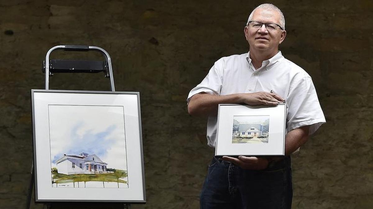
Watercolors by Don Gore of Independence will be shown at 19 Below, 5 W. 19th St., on July’s First Friday. At left is his “Bazaar Schoolhouse,” and he holds a work featuring a bungalow.
