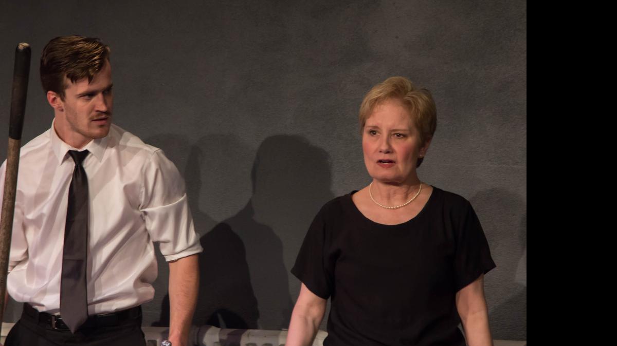 
Seth Maachi, left, plays a son trying to convince his mother (Peggy Friesen), to carry out a demanding father’s funeral wishes in “The Grave.”
