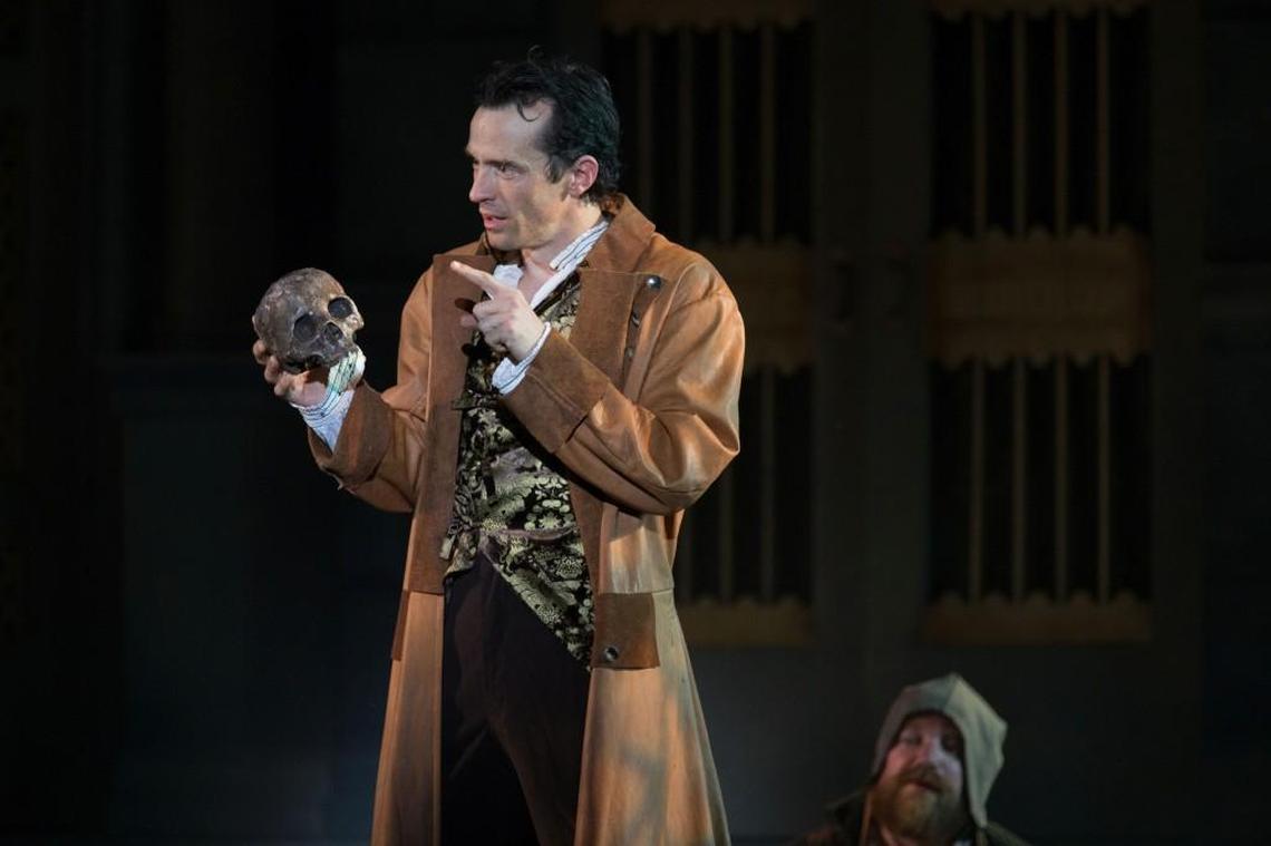 In a cemetery, Hamlet (Nathan Darrow) and a gravedigger (Matt Rapport) ponder mortality. Darrow returned to his hometown in 2017 to star in the Heart of America Shakespeare Festival production.