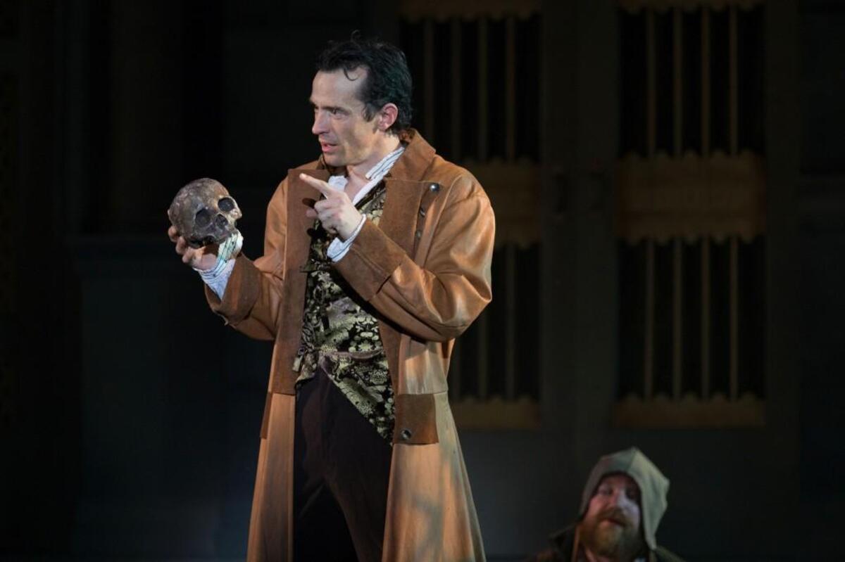 In a cemetery, Hamlet (Nathan Darrow) and a gravedigger (Matt Rapport) ponder mortality. Darrow returned to his hometown in 2017 to star in the Heart of America Shakespeare Festival production.