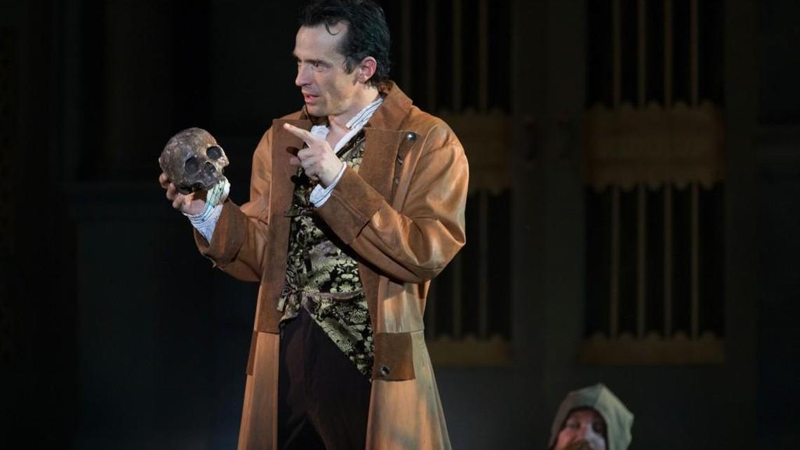 In a cemetery, Hamlet (Nathan Darrow) and a gravedigger (Matt Rapport) ponder mortality. Darrow returned to his hometown in 2017 to star in the Heart of America Shakespeare Festival production.