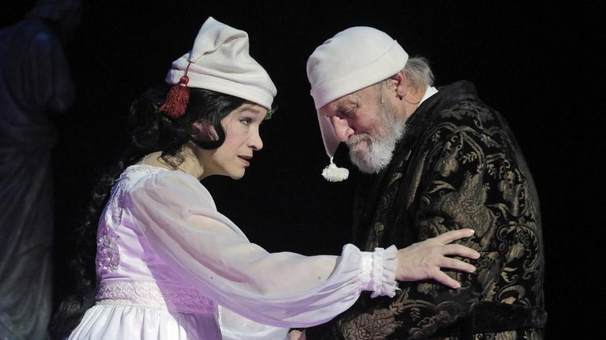 The Ghost of Christmas Past (Cheryl Weaver) visits Ebenezer Scrooge (Gary Neal Johnson) in “A Christmas Carol.”