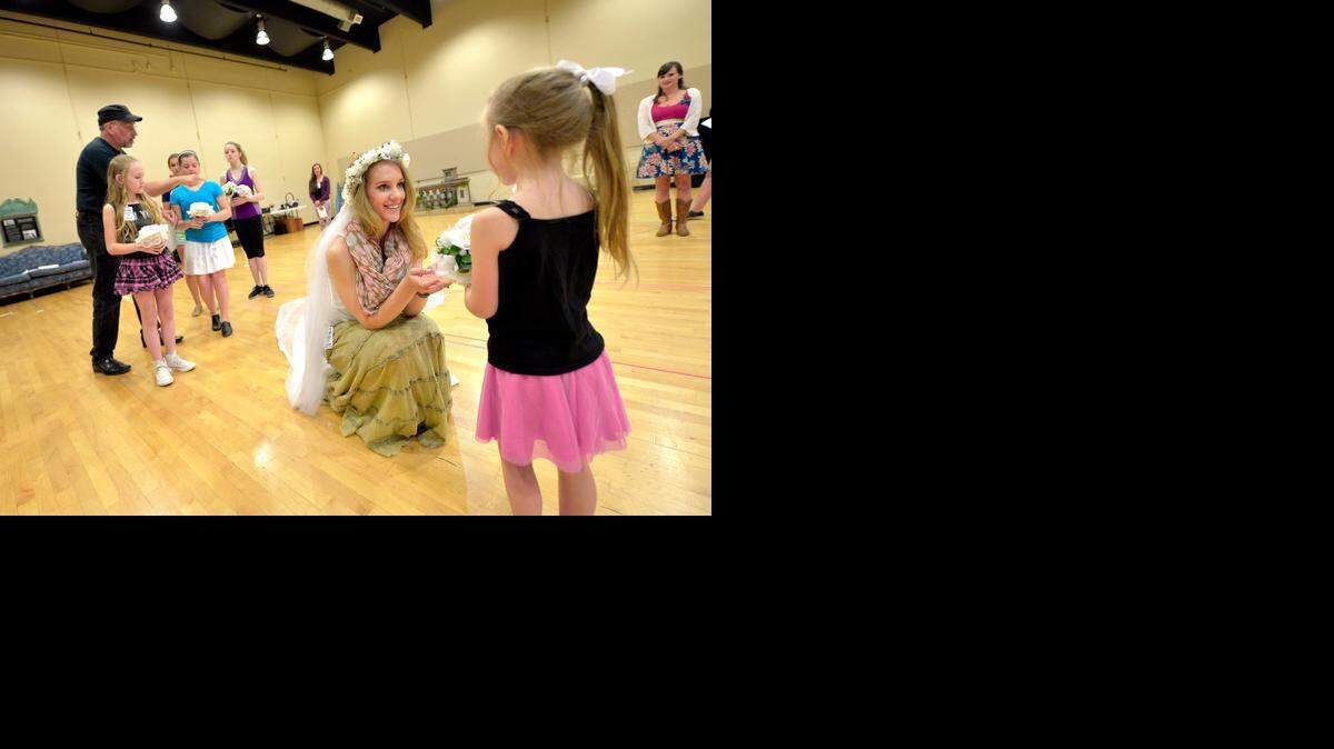 
Director Phil McKinley (left) worked with the cast of "The Sound of Music" Thursday, July 18, in a rehearsal room at Starlight Theatre. The musical is the only show this summer that Starlight is building from the ground up. Analisa Leaming portrays Maria and shared a moment here with Delilah Rose Pellow, who plays Gretl von Trapp.
