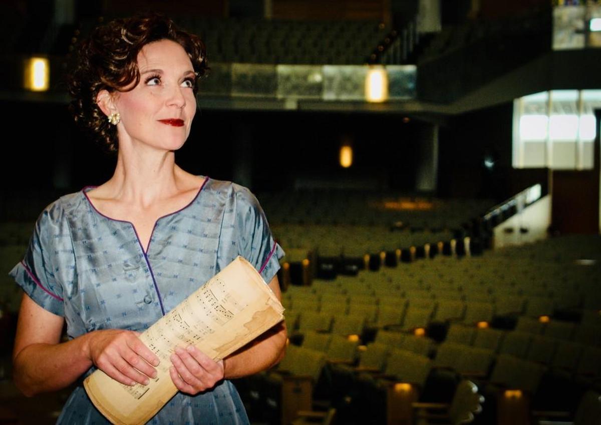 Krista Eyler plays a ticket-seller for the Kansas City Philharmonic in “Overture the Musical.” Eyler is also composer and co-book writer of the show about the grass-roots effort to save the Philharmonic in 1953.