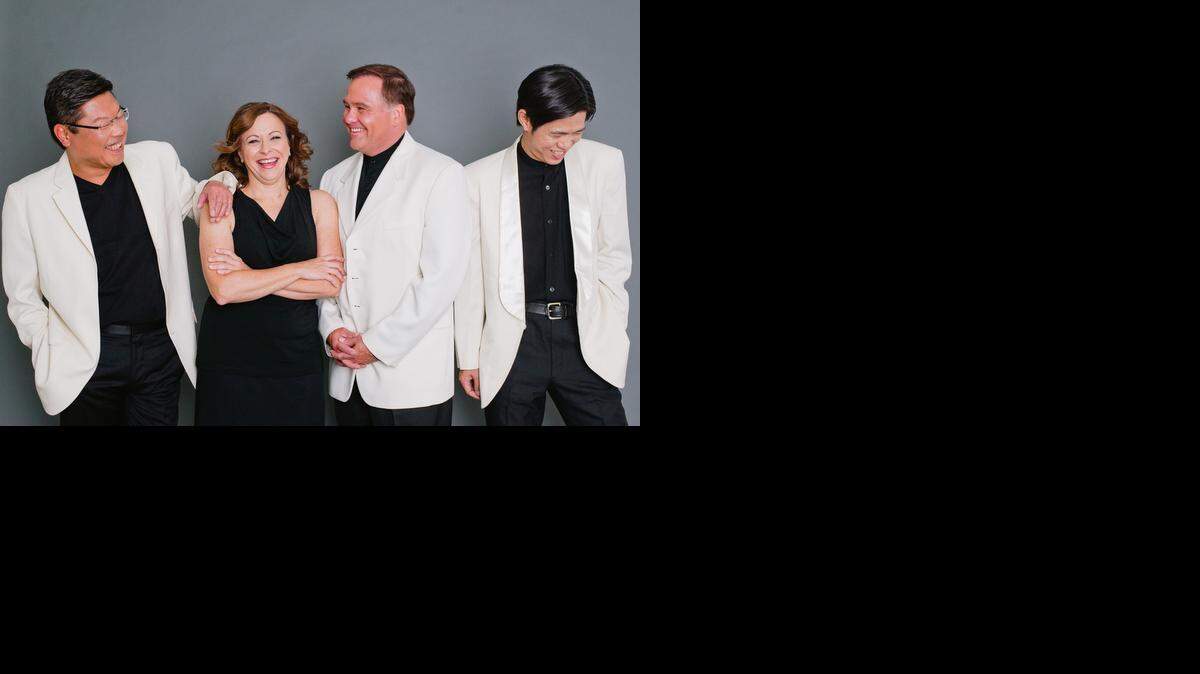 
Benny Kim, violin (from left); Cathy Meng Robinson, violin; Keith Robinson, cello and Scott Lee, viola, make up the Miami String Quartet.
