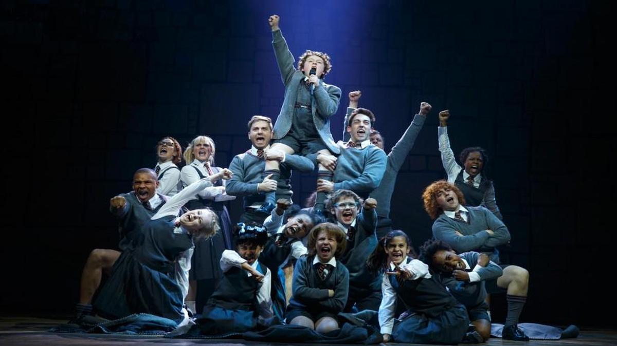 “Matilda: The Musical” is as charming and precocious as its heroine, with clever musical numbers, a fantastic child (and adult) cast, ingenious choreography and darkly caricaturized adult characters.