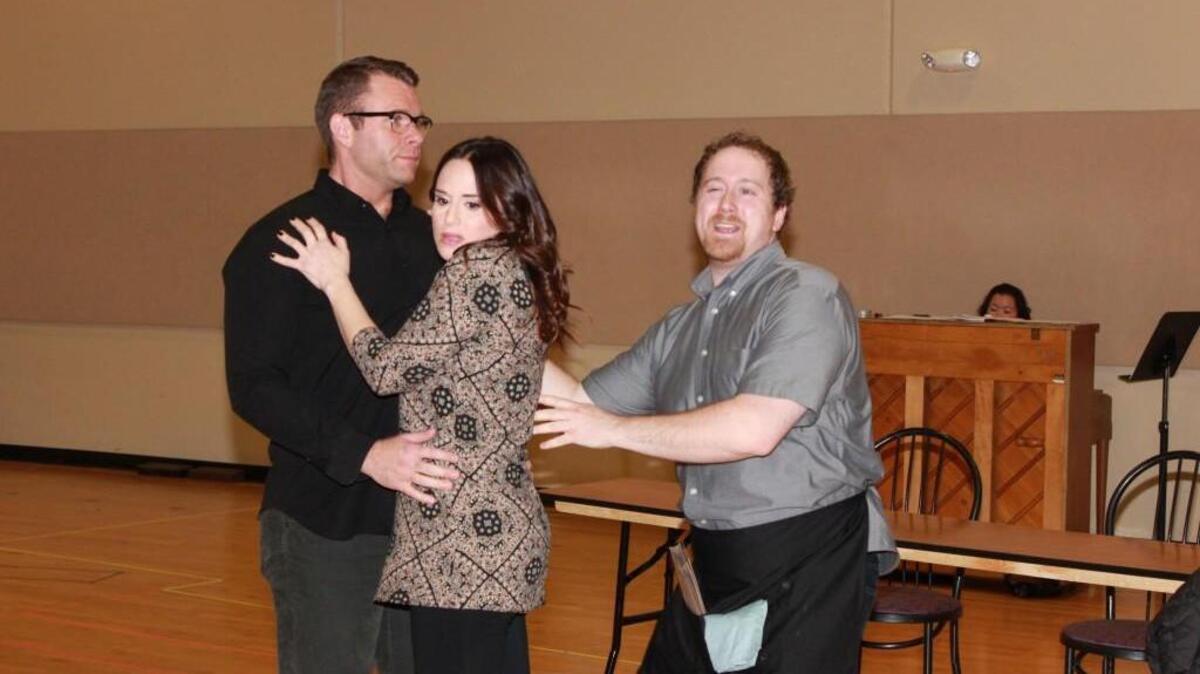 A couple on a blind date (Shea Coffman and Lauren Braton, in rehearsal) must contend with the voices of people from their past (including Andrew Schmidt, right).