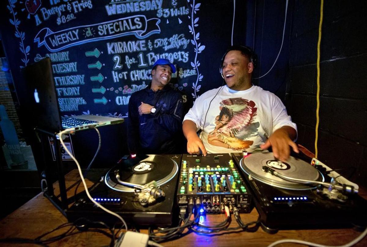 Promoter Joshua Lewis (left) and Quintin “DJ Q” Randle host the weekly Whiskey, Wine and Wings happy hour at Dempsey’s Burger Pub in Westport.