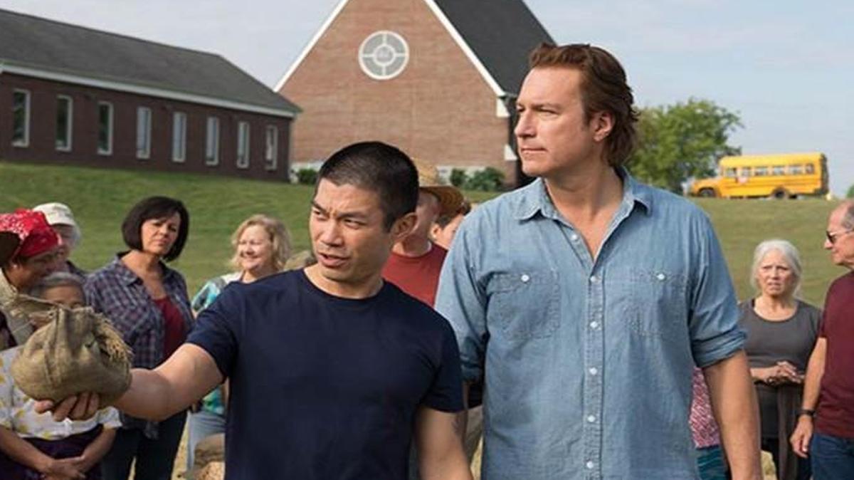 A refugee from Burma (Nelson Lee) seeks help from the pastor (John Corbett) of a Tennesee church.