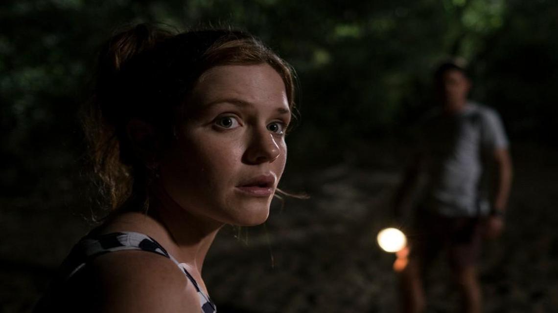 Samantha (Harriet Dyer) and Ian (Ian Meadows) hear something near their campsite.