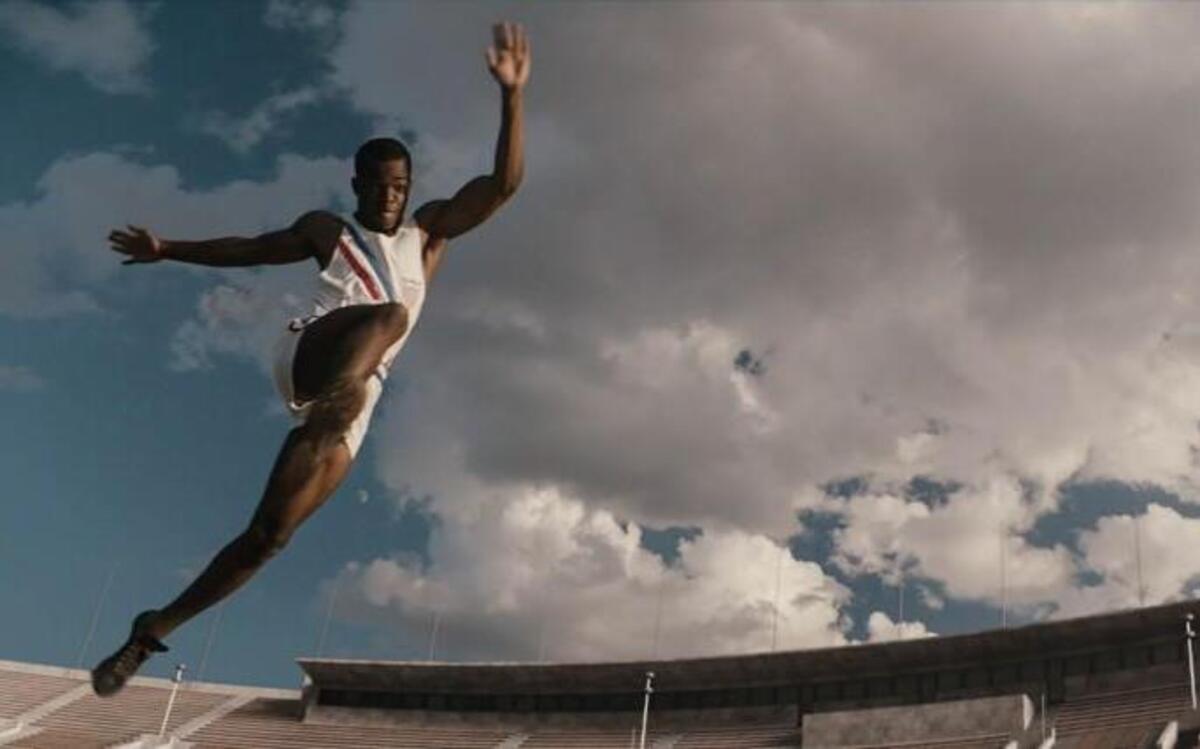 Stephan James makes a long jump attempt as Jesse Owens in “Race,” based on the story of Owens’ four Olympic gold medals won in Nazi Germany.