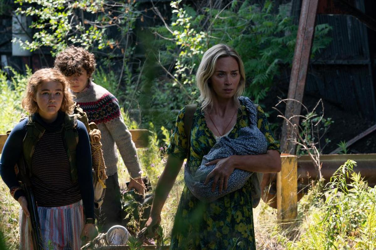 Regan (Millicent Simmonds), Marcus (Noah Jupe) and Evelyn (Emily Blunt) brave the unknown in “A Quiet Place Part II.”