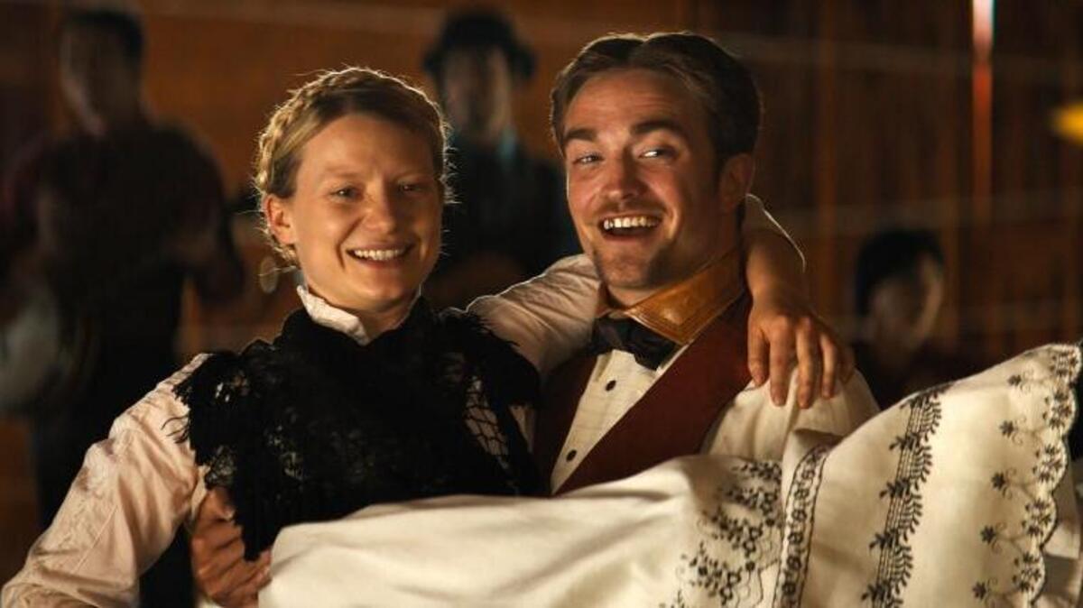 In the old West, Sam (Robert Pattinson) comes to rescue his love (Mia Wasikowska).