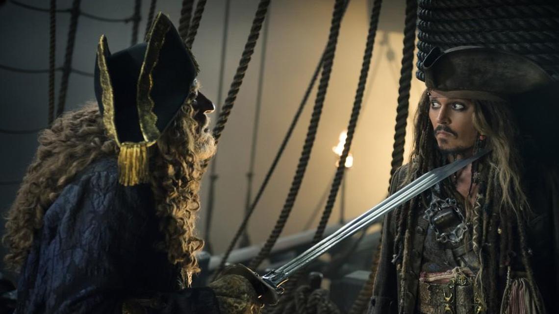 Once again, Captain Jack Sparrow (Johnny Depp, right) faces his old nemesis, Barbossa (Geoffrey Rush).