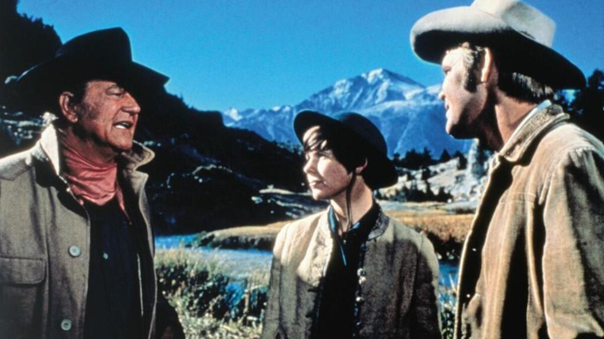 Glen Campbell (right) starred with John Wayne and Kim Darby in 1969’s “True Grit.”