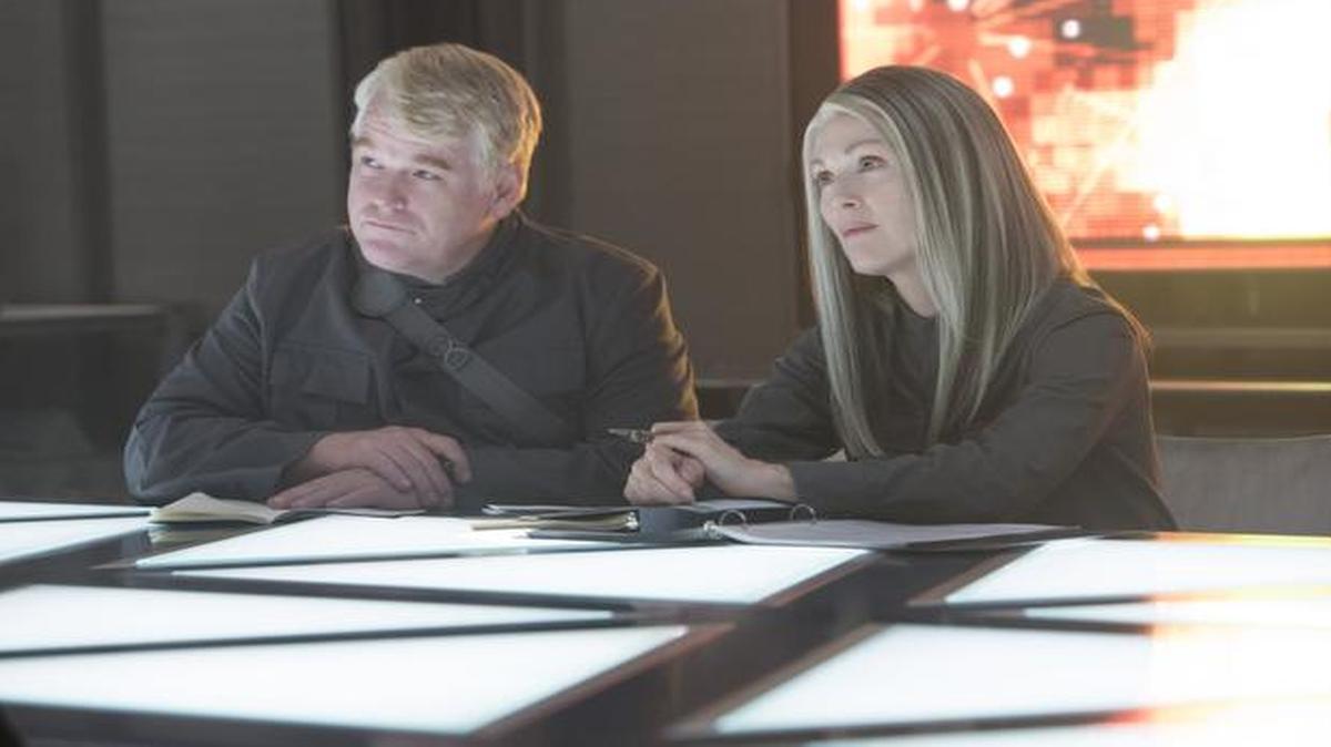 
Running the show in District 13: Gamemaker-turned-rebel-strategist Plutarch Heavensbee (Philip Seymour Hoffman) and President Alma Coin (Julianne Moore).

