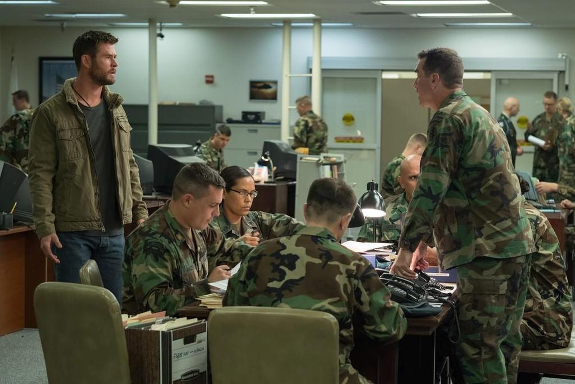 Chris Hemsworth (left) stars in “12 Strong” as Capt. Mitch Nelson, a character based on Kansan Mark Nutsch, a veteran Green Beret officer who led the first special forces team into Afghanistan after the 9/11 attacks. Overland Park native Rob Riggle plays Lt. Col. Bowers in the war drama.