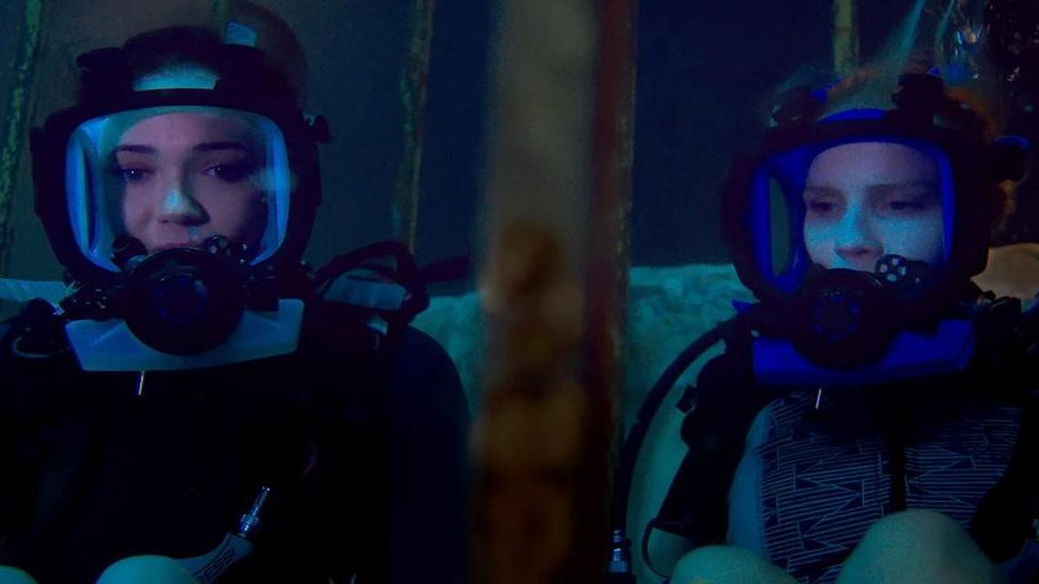 Sisters Lisa (Mandy Moore, left) and Kate (Claire Holt) are stuck at the bottom of the ocean floor.