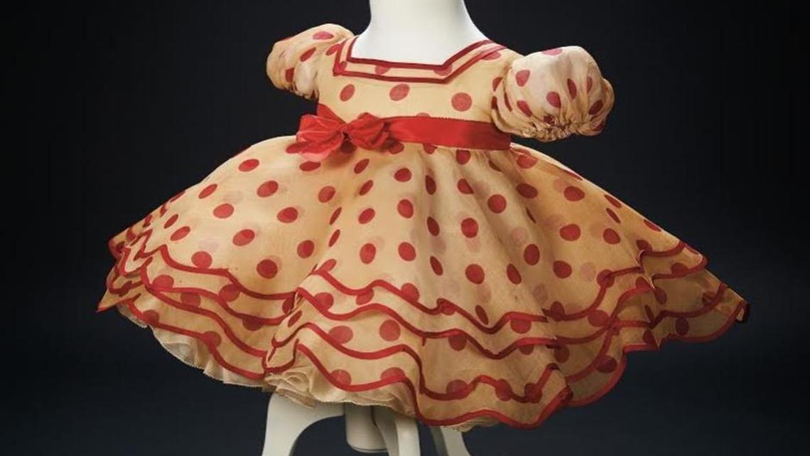 
The iconic red polka dot dress Shirley Temple wore in the 1934 movie “Stand Up and Cheer” sold for $75,000. The dress started at $20,000.

