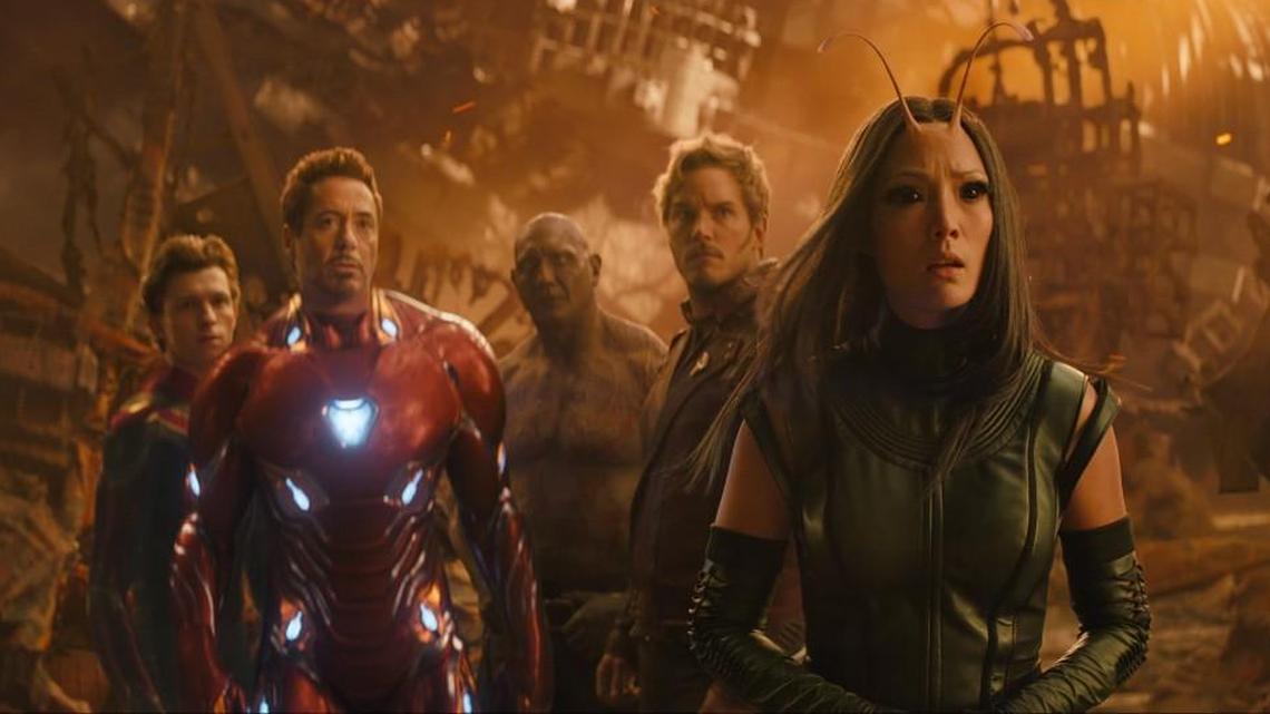 Superheroes — including Spider-Man (Tom Holland, left), Iron Man (Robert Downey Jr.), Drax (Dave Bautista), Star-Lord (Chris Pratt) and Mantis (Pom Klementieff) — join forces to defeat the evil Thanos in “Avengers: Infinity War.”