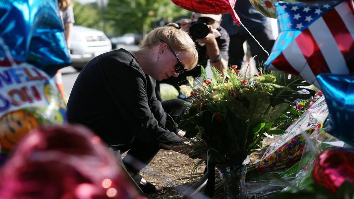 
Flowers and balloons marked a memorial that grew Wednesday outside the WDBJ7 Digital Broadcast Center in Roanoke, Va. 
