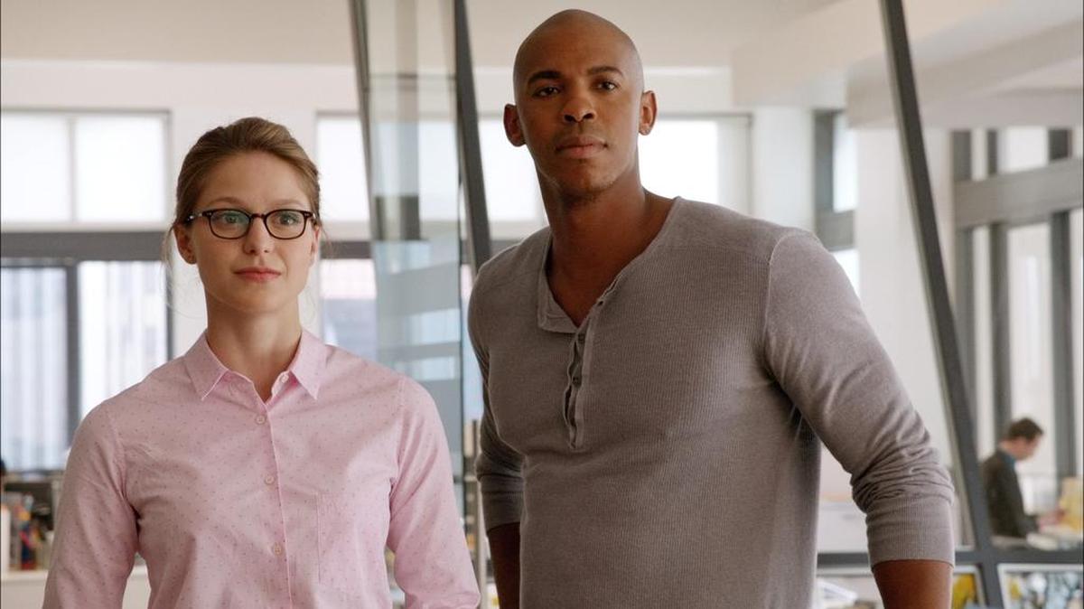 Supergirl, in her secret identity of Kara Danvers (Melissa Benoist), is assisted by her super-cousin’s friend James Olsen (Mehcad Brooks) in CBS’ “Supergirl.”