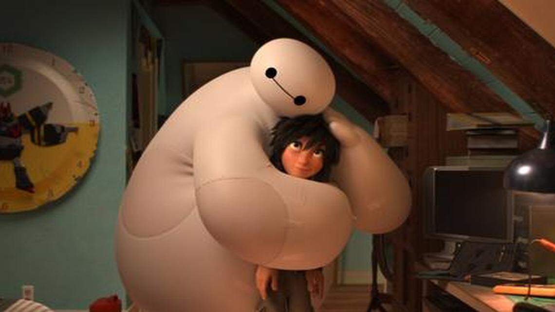 
A robot named Baymax (voiced by Scott Adsit) looks out for a teenage techie named Hiro (Ryan Potter).
