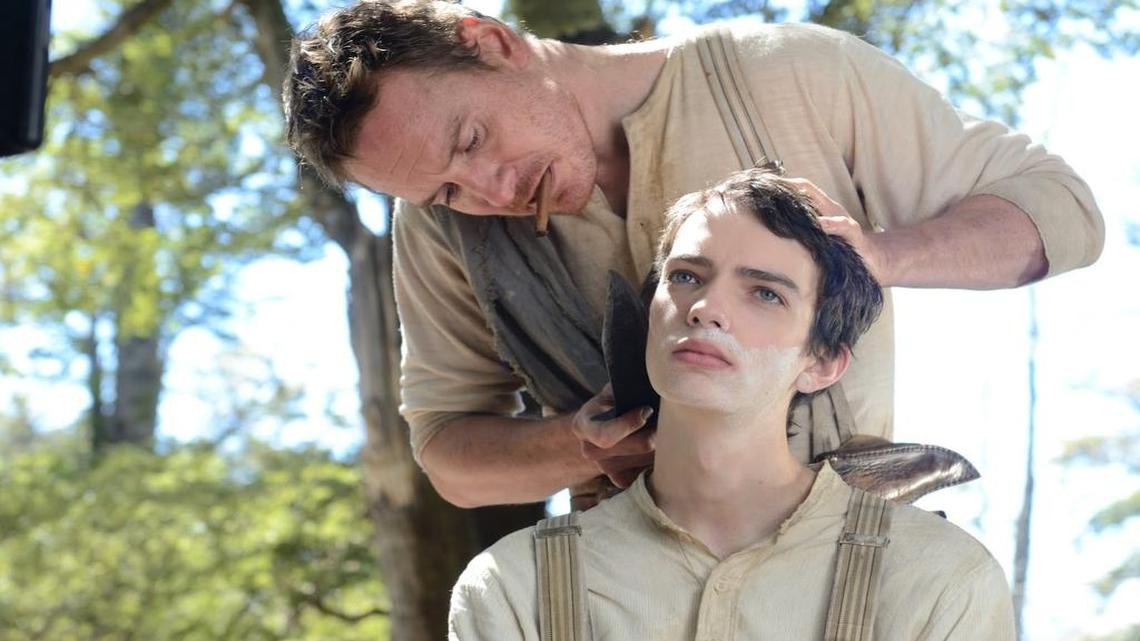 
An American drifter (Michael Fassbender) takes a Scottish teen (Kodi Smit-McPhee) under his wing. (Note the cigarillo — same kind Clint Eastwood munched on in his Westerns.)
