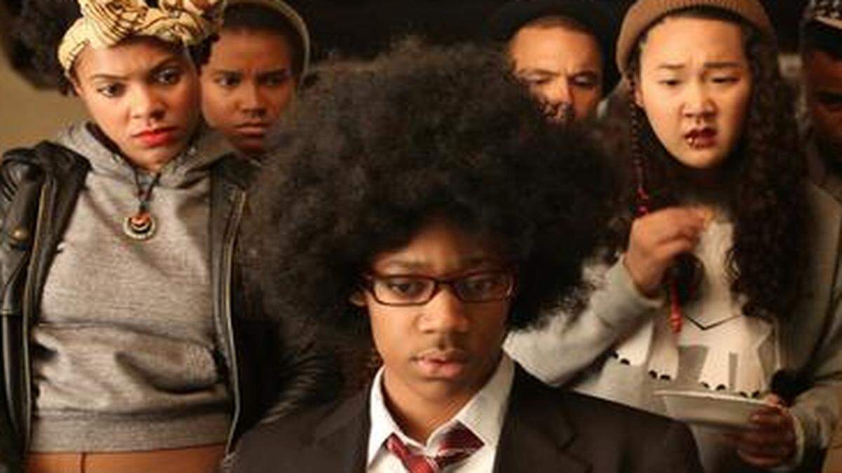 
Tyler James Williams (center) stars in “Dear White People,” a satire about African-American students’ experiences at a predominantly white university. 
