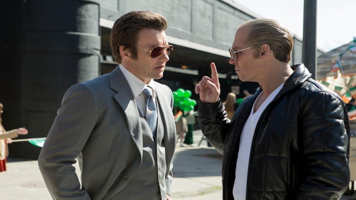 
Boston crime boss Whitey Bulger (Johnny Depp, right) enjoys federal protection, thanks to his childhood pal (Joel Edgerton) who became an FBI agent.
