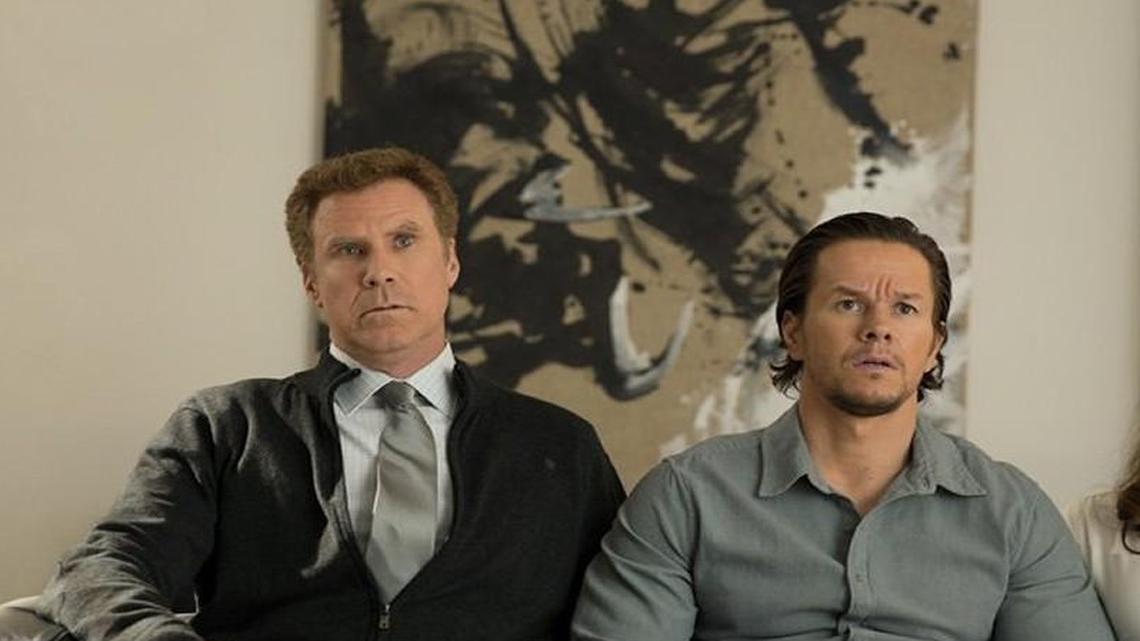 A stepdad (Will Ferrell, left) and his wife (Linda Cardellini) must contend with the kids’ outlandish biological dad (Mark Wahlberg).