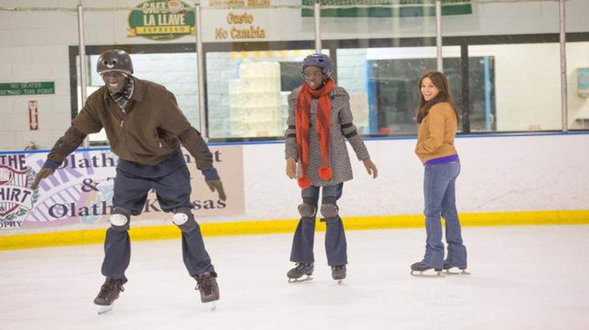 
Ger Duany (from left), Kuoth Wiel and Reese Witherspoon take to the ice (in Olathe) in a scene from “The Good Lie.” The movie was actually filmed in Atlanta.

