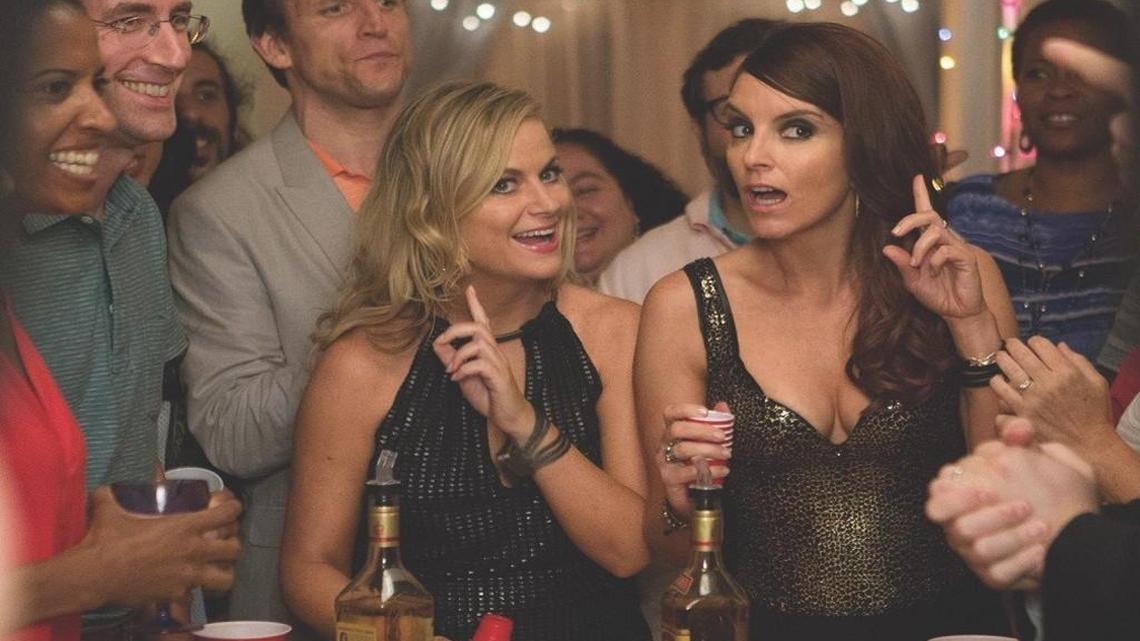 The Ellis sisters (Amy Poehler, left, and Tina Fey) must clean out their parents’ home, so they decide to make it a giant party.
