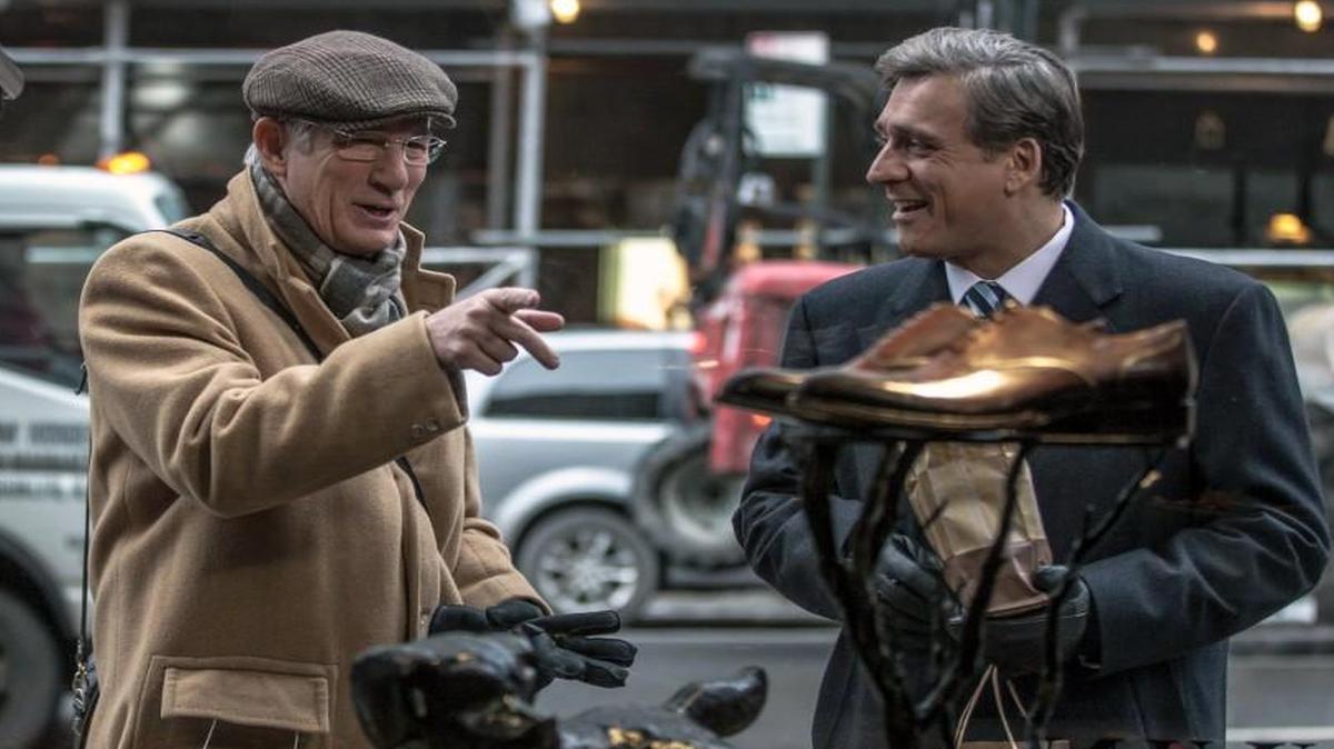 Norman (Richard Gere, left) schmoozes with an ambitious Israeli official (Lior Ashkenazi).