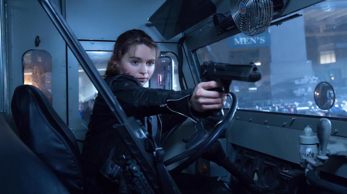 
In a twist on the original mythology, Sarah Connor (Emilia Clarke) has been raised from childhood by a T-800 cyborg (Arnold Schwarzenegger) programmed to protect her.
