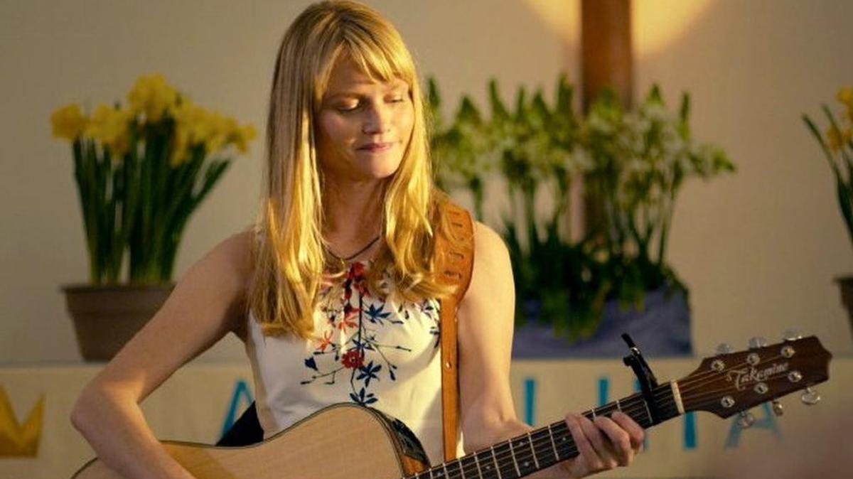 Lindsay Pulsipher plays a young widow questioning her faith in “God Bless the Broken Road.”