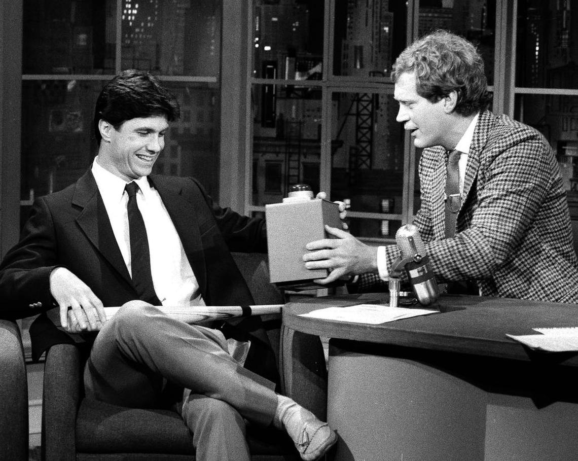 Comedian/talk show host David Letterman, right, presents Kansas City Royals shortstop Buddy Biancalana with a gadget comparing his baseball hits total to that of Pete Rose?s noting in jest that Biancalana is only 4,000 or so behind, during the show in New York on Wednesday, Nov. 6, 1985. Biancalana gained fame when he helped the Royals win the World Series against the Cardinals, after hitting only .188 during the season. (AP Photo/Richard Drew) ORG XMIT: APHS265252