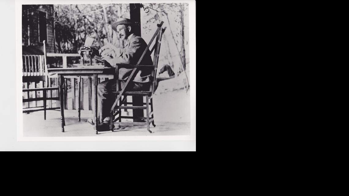 
L. Frank Baum at work on the porch of his summer home.

