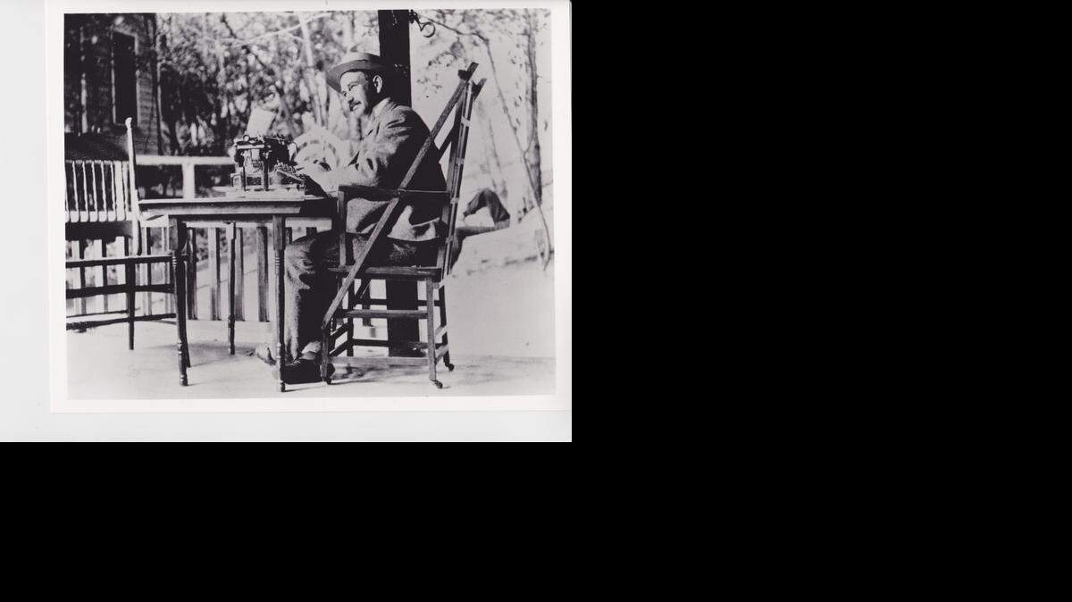 
L. Frank Baum at work on the porch of his summer home.
