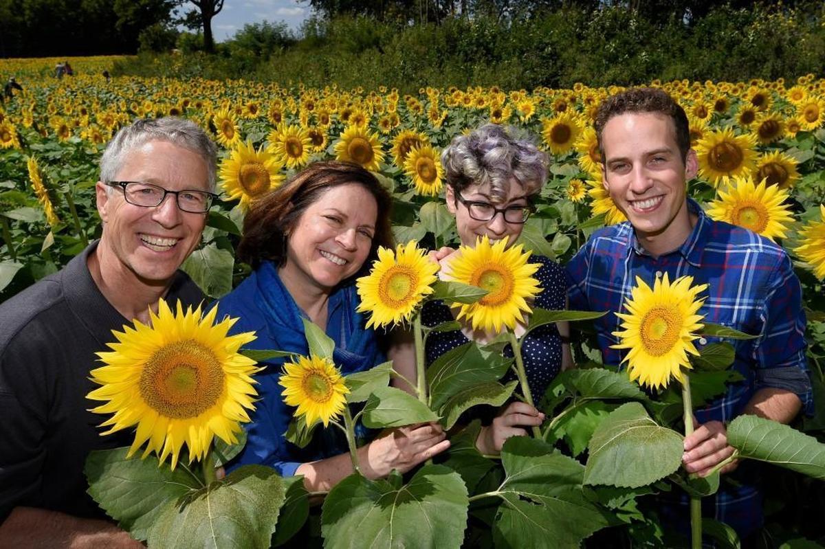 When the sun is overhead, use your camera’s flash to help light the faces of your subjects. Here’s Reed Hoffmann (left) with his family, Sharon, Rachel and Nathan.