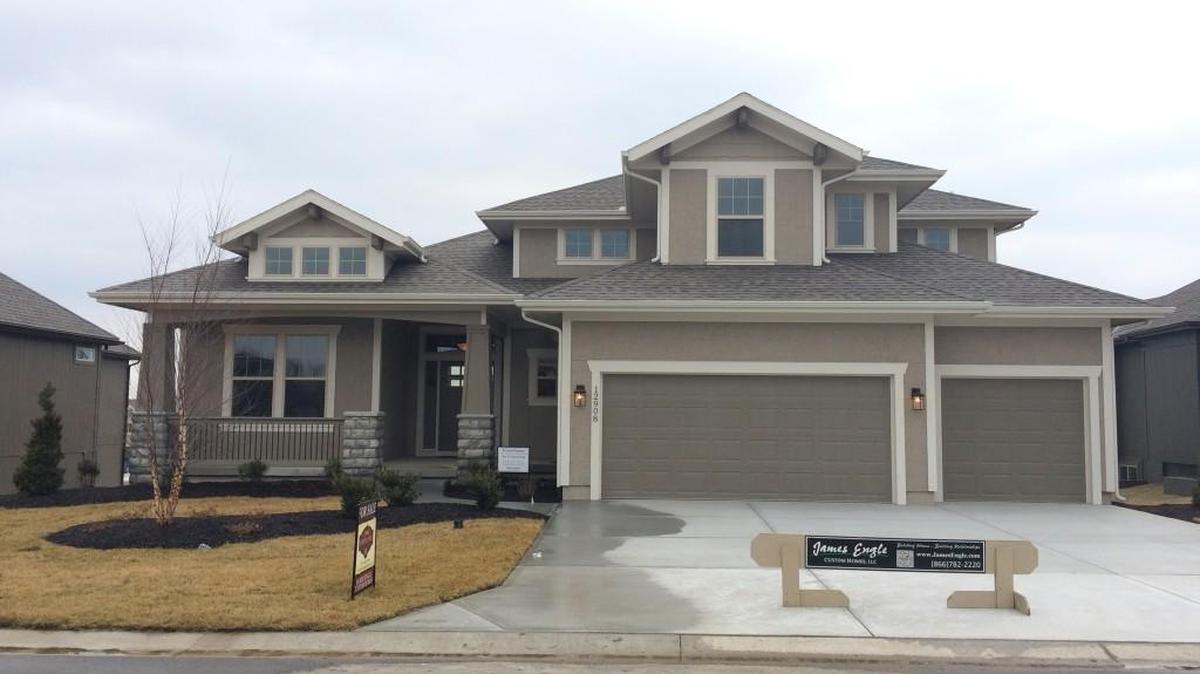 James Engle Custom Homes offers the Emery EXP 1 ½-story at 12908 W. 169th St. Priced at $466,782, the home features a covered deck, arch beam ceiling and four bedrooms on a daylight green space lot with 30-day delivery.