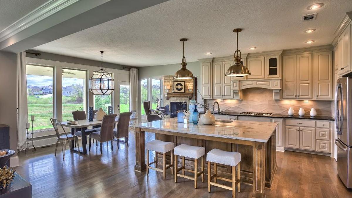 One of Wyngate’s new model homes, the two-story Lancaster EX is built for entertaining and a busy family lifestyle. The spacious gourmet kitchen is the centerpiece of the open main level.