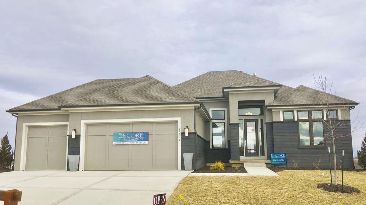 Encore Builders by Casa Bella features their Stanton reverse 1½-story home, located at 17221 Bradshaw, with a walkout basement, a walk-behind bar, and a covered deck and patio. Priced at $529,900, the home has 30-day availability and is open today until 5 p.m.