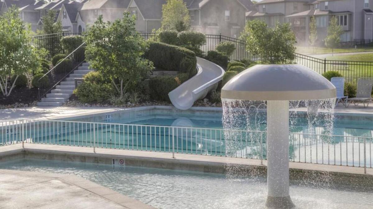 Wyngate’s lush resort-style pool, complete with a water slide, is nestled in the beautifully landscaped community, a welcome family attraction during the warm weather months.