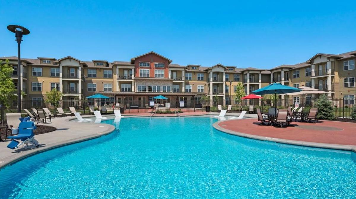 Residents enjoy relaxing by the large heated pool.