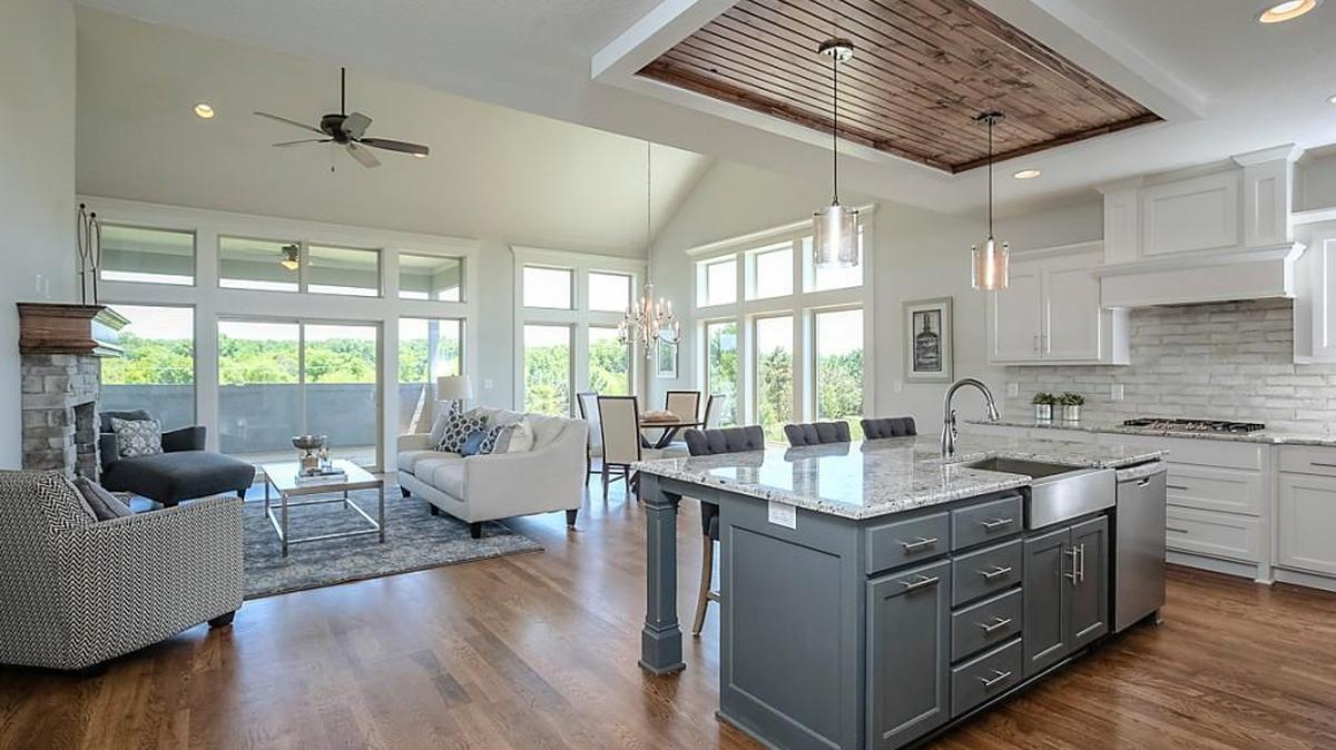 This Hazelwood floor plan is sure to delight with floor-to-ceiling windows, a beautiful chef’s kitchen with a farmhouse sink, and soaring vaulted ceilings.