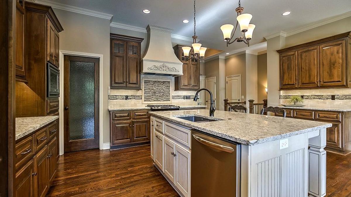 Custom cabinetry, granite countertops and hardwood floors are among the luxurious finishes featured in the gourmet kitchens at Gatewood Villas.