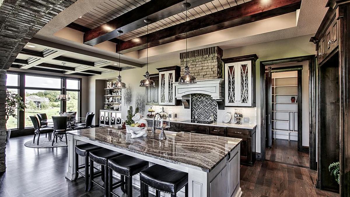 Prospective buyers are encouraged to visit Cottonwood Canyon and tour the community’s new model home, an award-winning reverse 1½-story floor plan from B.L. Rieke Custom Homes (pictured).